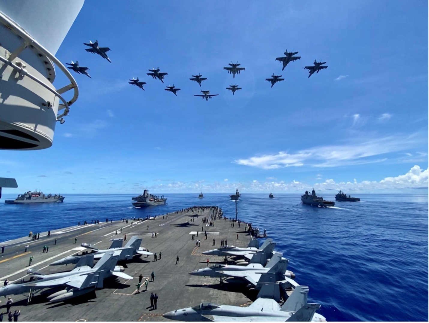 Military aircrafts taking off from a ship