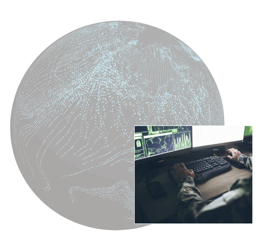 Sphere with digital texture and a man typing on a desktop computer